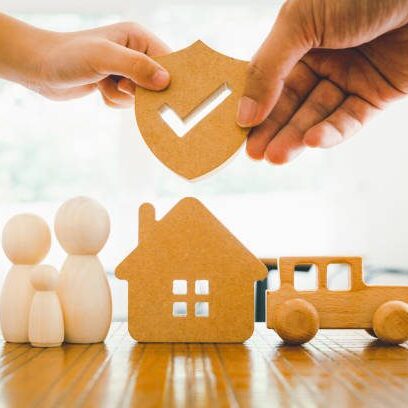 Businessman holding shield protect icon with his child, Security protection and health insurance. The concept of family home, protection, health care day, car insurance and home school education.